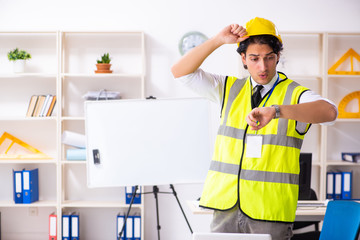 Male construction engineer working in the office 