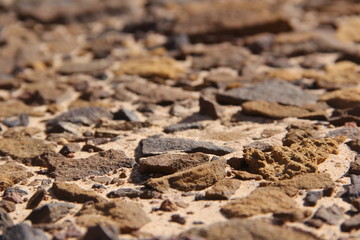 The stony texture of reddish, brown and yellow shades