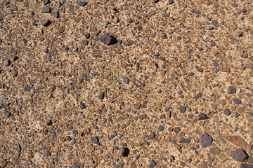 The stony texture of reddish, brown and yellow shades