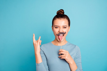 Portrait of charming beautiful careless teen teenager student excited have free time weekend holiday make faces wear stylish trendy pullover feel cool relaxed rest isolated scream on blue background