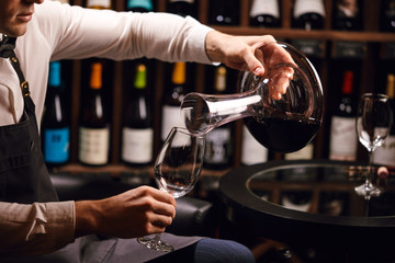 Staff training for sommelier experts. All that is needed is wine etiquette, the rules for buying wine for the customer, decanting and pouring wine into glasses.