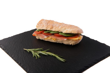 sandvich on the dark bord with rosemary