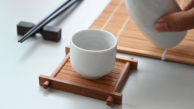 Asian men Pouring japanese sake oriental drink style 4K footage