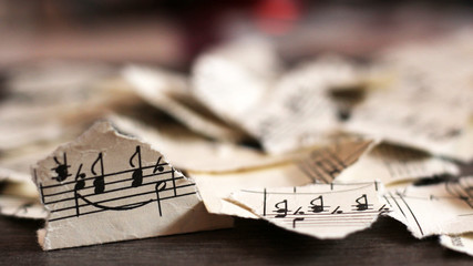 Torn musical notes, pieces of paper