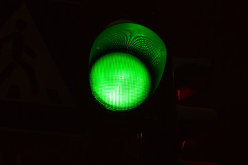 Green light of traffic light on the crossing. Road crossing permit, signal to go.