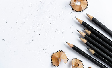 A pencil and a piece of a pencil on white paper background. Copy space for your text or image.