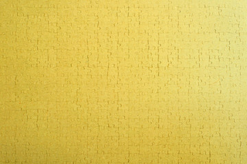 mosaic bright colored background from a puzzle, golden tone