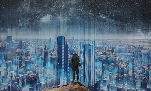 Smart city and technology, a man standing on rock with futuristic modern smart city skyscraper view