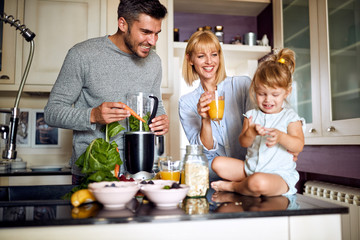 Man and woman with child having breakfast