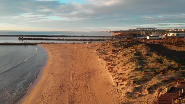 The beach of La Marina and the entrance to the Marina of Guardamar seen from the air.