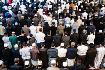 Muslim prayer. A group of Muslim men pray inside a Mosque. Islam Religion.