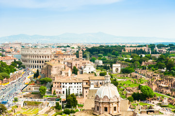 Fototapeta premium Beautiful aerial view: Colosseum and Roman Forum in sunny spring day. Rome. Italy