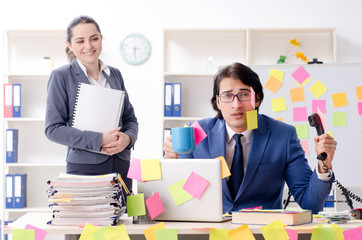 Two colleagues employees working in the office 