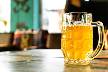 Jugs of beer placed on table with copy space