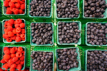 Containers of fresh berries at the farmers market