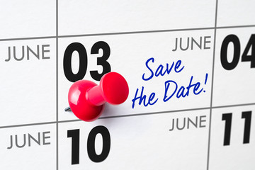 Wall calendar with a red pin - June 03