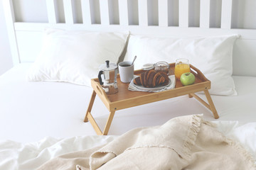 Morning Breakfast in bed. Coffee, croissants, fresh orange juice.