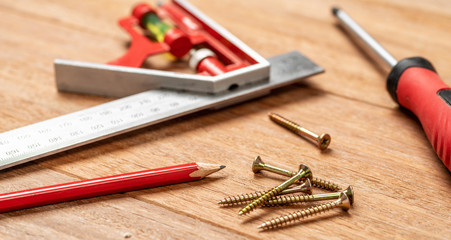 Woodworking tools on a wooden background