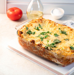 lasagne, on a light marble backdrop, light background