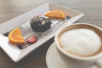 chocolate lava cake with fresh fruit and coffee