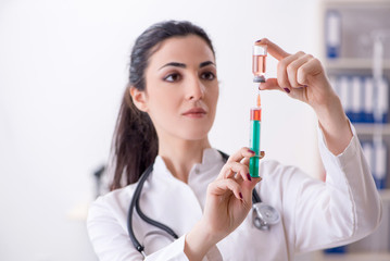 Young female doctor in infusion concept 