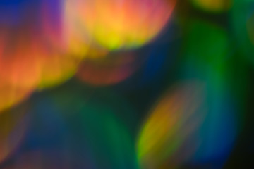 Blur colorful lens flare spots. Defocused abstract background. Bokeh Illuminated glow.