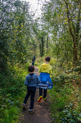 A family on a walk along country lanes at th evillage of Perton near Wolverhampton in South Staffordshire, UK