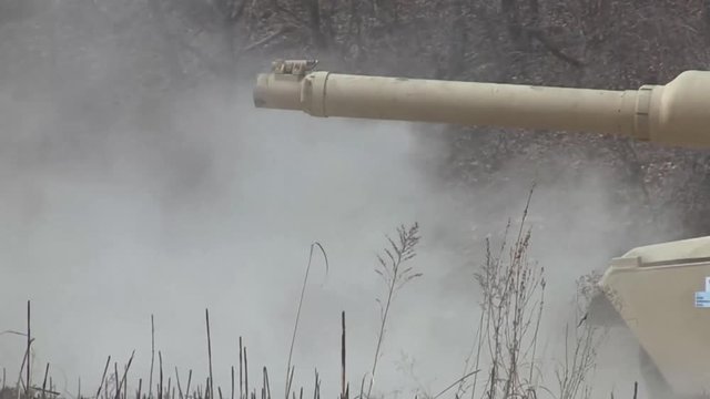 M1 Abrams tank firing main gun