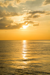 Landscape of sea during the morning sunrise or evening sunset period with light reflection on water.
