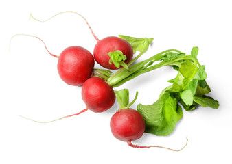 A few fresh early radishes with green leaves on a white isolated background. View from above.