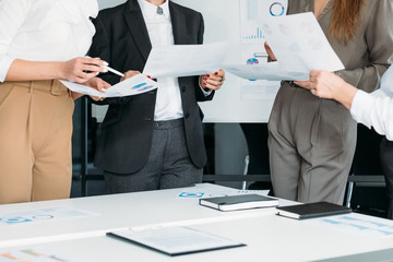 Successful women in business. Corporate meeting. Cropped shot of female coworkers holding graphs,...