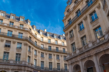 Fototapeta na wymiar Paris, ancient buildings, typical narrow facades in the center, place Edouard VII