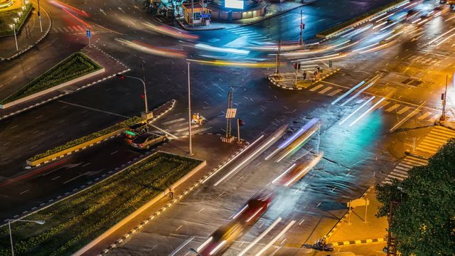 Cinemagraph 4K resolution, Cityscape Bangkok downtown at night, from the top of view on skyscraper,  show lighting on the road of communication concept. Abstract background with HRD effect filter.