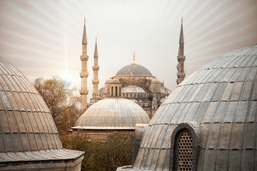 Sun rays radiance from the Blue Mosque (Sultan ahmet Camii), Istanbul, Turkey. View from the roofs.