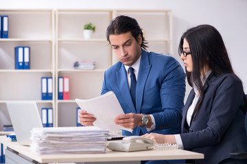 Two employees working in the office 