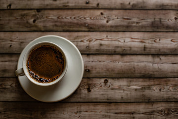 White coffee Cup on wood natural background