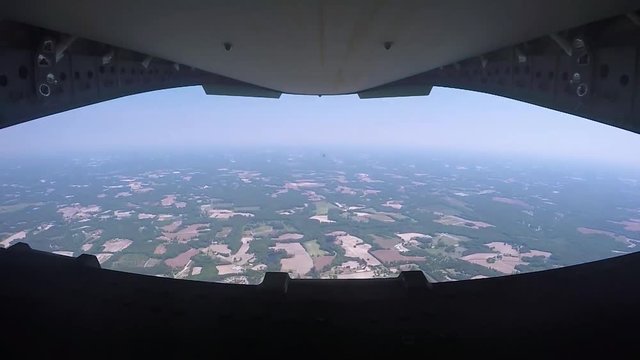 Lockheed C-130 back door opens in flight 