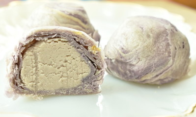 mashed taro stuffed cake half cut on plate