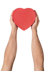 Obraz premium Male hand holding a red box in the shape of a heart. Isolate on white background