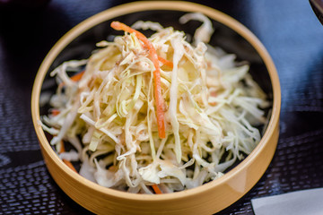 Fresh chopped cabbage served with roasted sesame seed dressing
