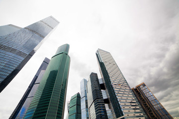 Naklejka na ściany i meble Skyscrapers against the sky. Glass buildings of the modern city.