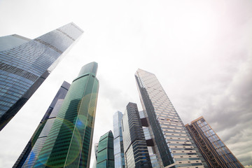 Naklejka na ściany i meble Skyscrapers against the sky. Glass buildings of the modern city.