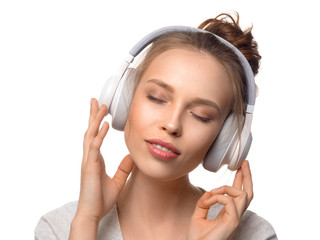 attractive girl with headphones on white background