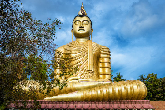 Buddha in the Wewurukannala Vihara old temple in the town of Dickwella, Sri Lanka