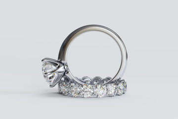 Solitaire diamond engagement ring, eternity wedding band, on white background