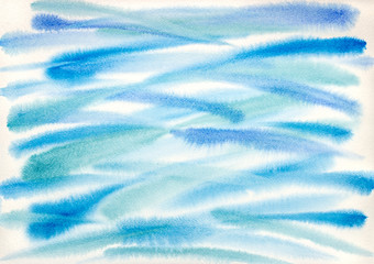 abstract blue and green paint brushstrokes on watercolor paper