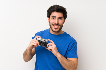 Handsome man holding a camera