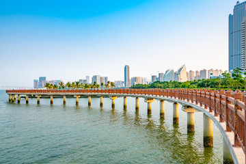 Fototapeta na wymiar Bridges and buildings in Golden Bay, Zhanjiang city