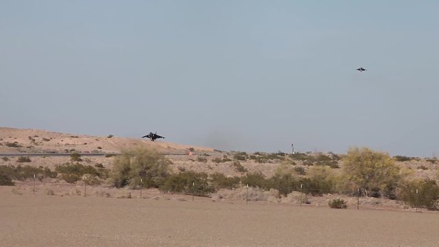 AV-8B Harrier jets landing onto air force base