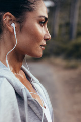 Female runner with earphones